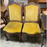 A pair of Louis XVI style upholstered carved oak dining chairs, width 46cm, depth 42cm, height