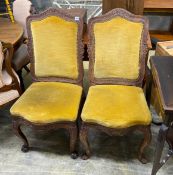 A pair of Louis XVI style upholstered carved oak dining chairs, width 46cm, depth 42cm, height