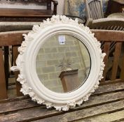 A circular white painted composition wall mirror with engraved plate, diameter 62cm