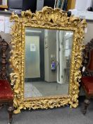 A late 18th early / 19th century rectangular carved giltwood florentine wall mirror formerly the