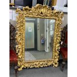 A late 18th early / 19th century rectangular carved giltwood florentine wall mirror formerly the