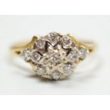 A modern 18ct gold and diamond chip set cluster ring, size 4 grams.