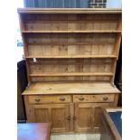 A Victorian pine dresser with boarded rack, length 173cm, depth 44cm, height 230cm
