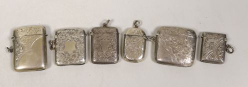 Six assorted mainly early 20th century engraved silver vesta cases, largest 56mm.