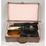 A small suitcase of draughtsman’s, scientific and medical instruments and a champagne tap