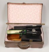 A small suitcase of draughtsman’s, scientific and medical instruments and a champagne tap