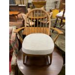 An Ercol beech comb back armchair, width 64cm, depth 52cm, height 81cm