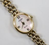 A lady's modern 9k Rotary Elite oval dial quartz wrist watch, on a 375 bracelet, overall 18cm, gross