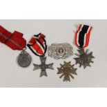 Four German Third Reich medals, comprising three merit crosses, and a Winterschlacht medal, together