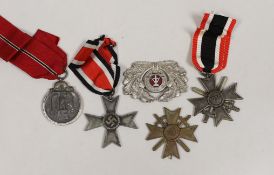 Four German Third Reich medals, comprising three merit crosses, and a Winterschlacht medal, together