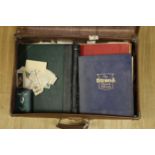 ° ° A suitcase of stamp albums