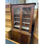 An early Victorian mahogany bookcase cupboard, width 105cm, depth 31cm, height 222cm