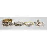Three modern 9ct gold and diamond chip set rings and a yellow metal and solitaire diamond set