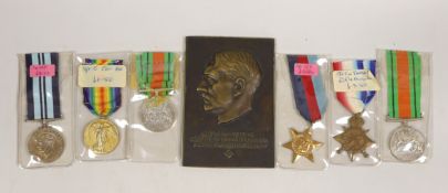Two WWI medals, other medals and an Adolf Hitler bronze plaque