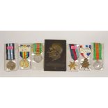 Two WWI medals, other medals and an Adolf Hitler bronze plaque