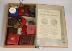 A mixed collection of British cased commemorative medallions to include a cased silver and two