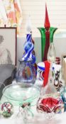 A large group of mixed art glass and other coloured glass vases, bowls, paperweights and two