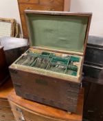 A Victorian iron bound oak silver chest with three interior trays housing assorted silver plated
