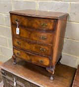 A small Queen Anne revival walnut bow front chest of four drawers, width 62cm, depth 43cm, height