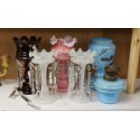 A pair of Victorian lustres two others and an oil lamp, tallest 26cms high