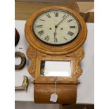 An oak cased drop dial wall clock, with key and pendulum