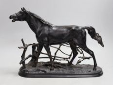 A Russian black painted cast iron horse model, maker’s mark to base. 42cm long
