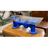 An industrial style cast iron steam pump glass top coffee table, length 93cm, width 48cm, height