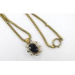 A Victorian pinchbeck and banded agate set pendant, 39mm, on a gilt metal chain.