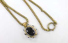 A Victorian pinchbeck and banded agate set pendant, 39mm, on a gilt metal chain.