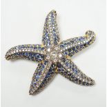 A mid to late 20th century 750 yellow metal, sapphire and diamond cluster set starfish brooch,