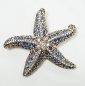 A mid to late 20th century 750 yellow metal, sapphire and diamond cluster set starfish brooch,