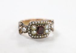 A 19th century yellow metal, foil backed? garnet and split pearl set ring (repair), size O/P,