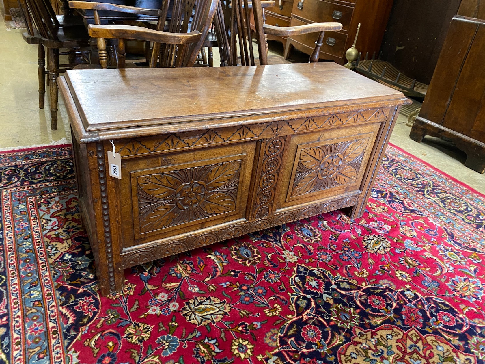 An 18th century style carved oak coffer, width 114cm, depth 43cm, height 55cm