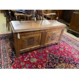 An 18th century style carved oak coffer, width 114cm, depth 43cm, height 55cm