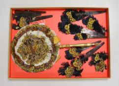 A 19th century feather face fan with gilt painted handle and tortoiseshell fan guards with similar