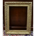 An 18th century French gilt carved wood picture frame, the aperture 51 x 38cm