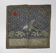 A Chinese rank badge, finely embroidered in multi coloured silks and gold thread, with an