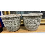 A pair of circular reconstituted stone garden planters, diameter 30cm, height 24cm