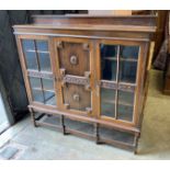 A1920's oak bookcase, length 150cm, depth 35cm, height 150cm