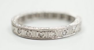 A white metal, stamped plat and diamond chip set full eternity ring, size K, gross weight 3.7