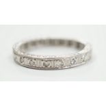 A white metal, stamped plat and diamond chip set full eternity ring, size K, gross weight 3.7