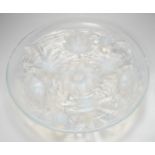 A Verlys opalescent glass dish with flower decoration. 35cm diameter