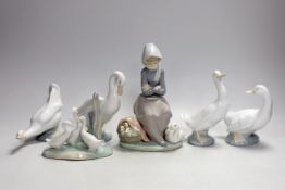 A Lladro seated girl with ducks and five Nao ducks