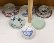 A group of Chinese plates and dishes including a Ming dynasty blue and white bowl