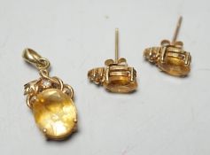 A modern 14k, citrine and diamond chip set pendant, 15mm and a pair of matching ear studs, gross