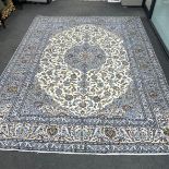 A Kashan ivory ground carpet, 364 x 284cm