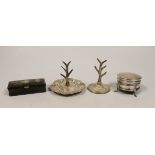 Two early 20th century silver ring stands, tallest 7cm, a small silver mounted trinket box and a