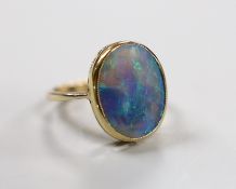 A 9ct and oval black opal set ring, size O, gross weight 4.3 grams.