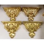 A set of four gilt wood wall brackets, 18.5cm tall x 24cm wide