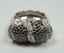 A modern 750 white metal and pave set two colour diamond dress ring, size K/L, gross weight 15.4